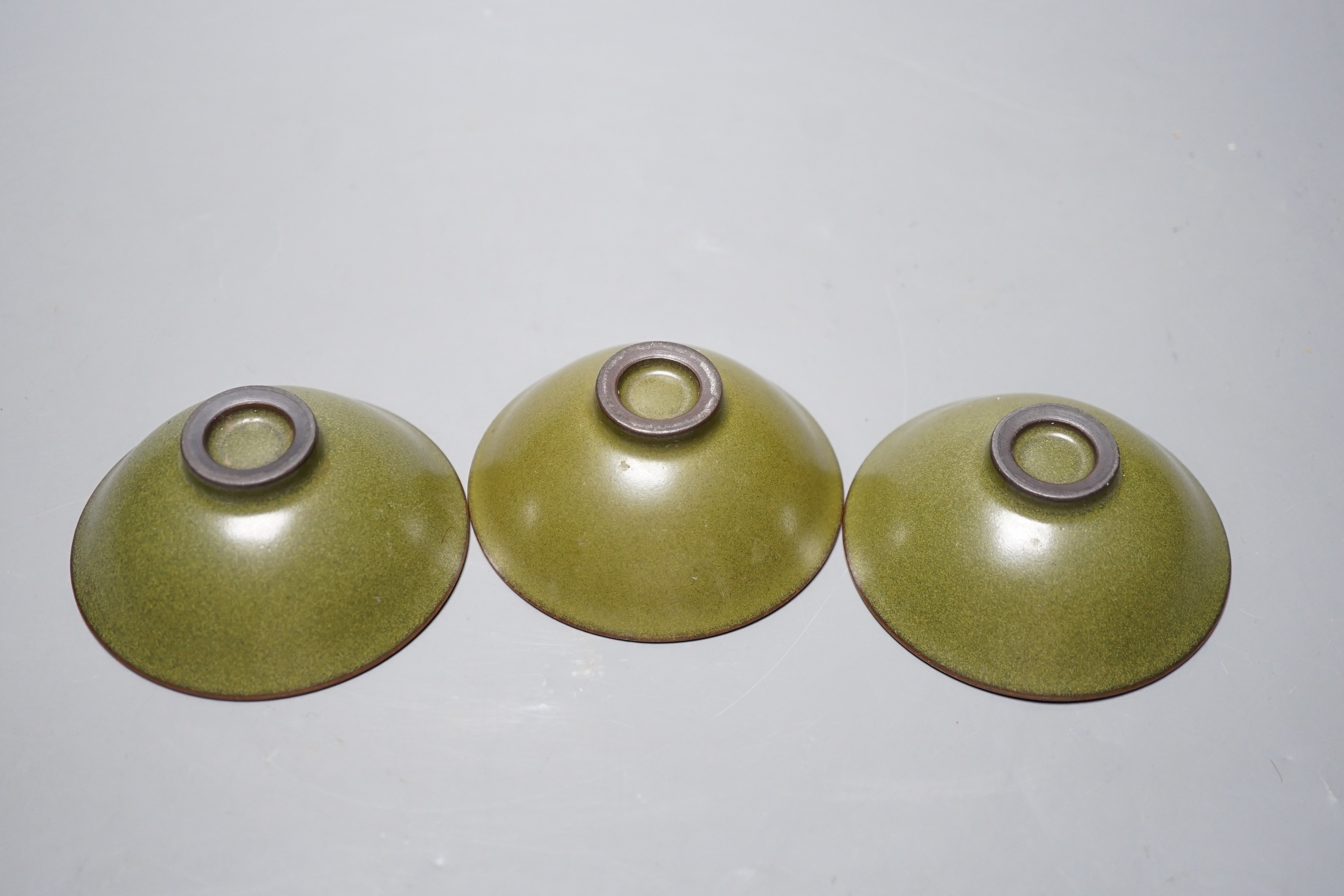 Three Chinese teadust glazed dishes, 8.5cm diameter